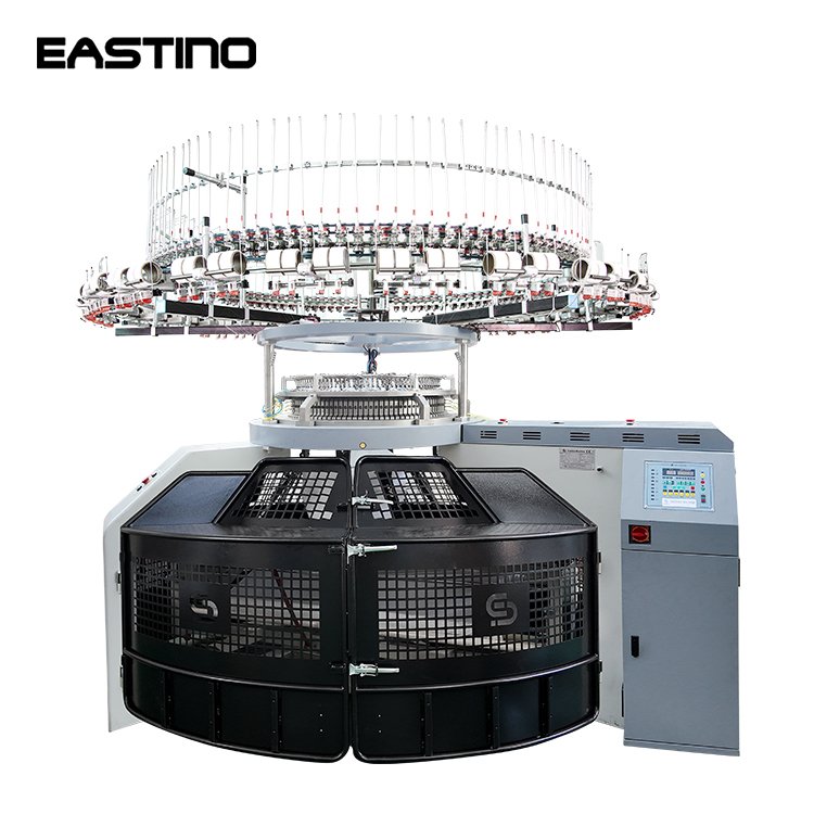 Side profile view of Eastino 34 inch single jersey open width circular knitting machine showing the frame, cylinder, and open width fabric takedown system.