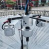 Top-mounted sealed cleaning motor and high-pressure fan blades for lint removal on circular knitting equipment
